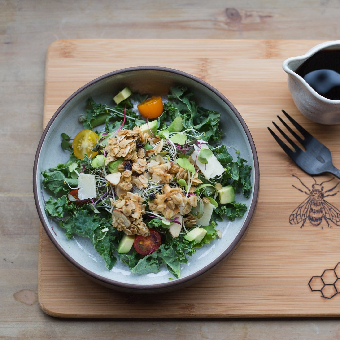 Jamie's Farm Gluten-Free Rosemary Granola on a fresh kale salad | gluten-free crouton alternative