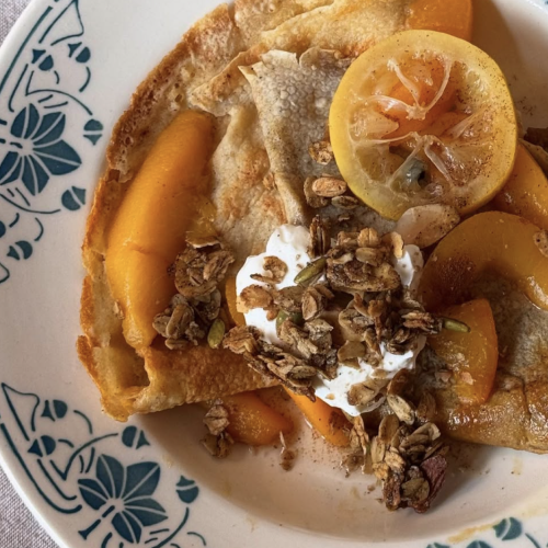 Caramelized Vanilla Bean Crepes with Poached Peaches and Granola