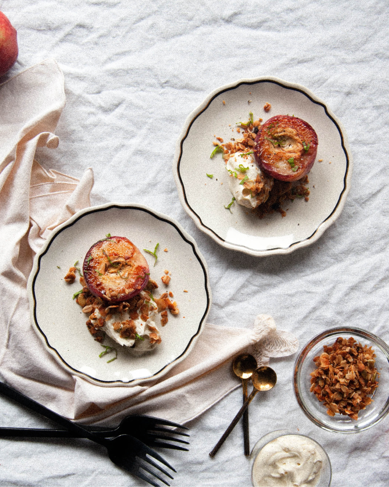 Grilled Brown Butter Peaches with Vanilla Bean Creme Fraiche from Vermont Creamery. Topped with fresh mint and rosemary granola for crunch. The perfect dessert for a simple BBQ.